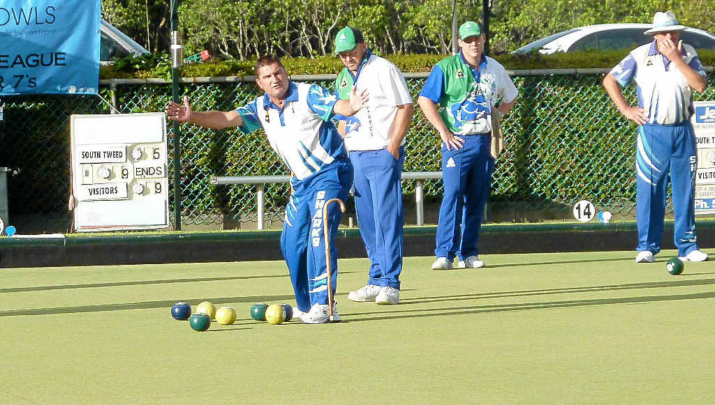 Kelvin Kerkow lets his teammate know how far his bowl was away from the jack. 